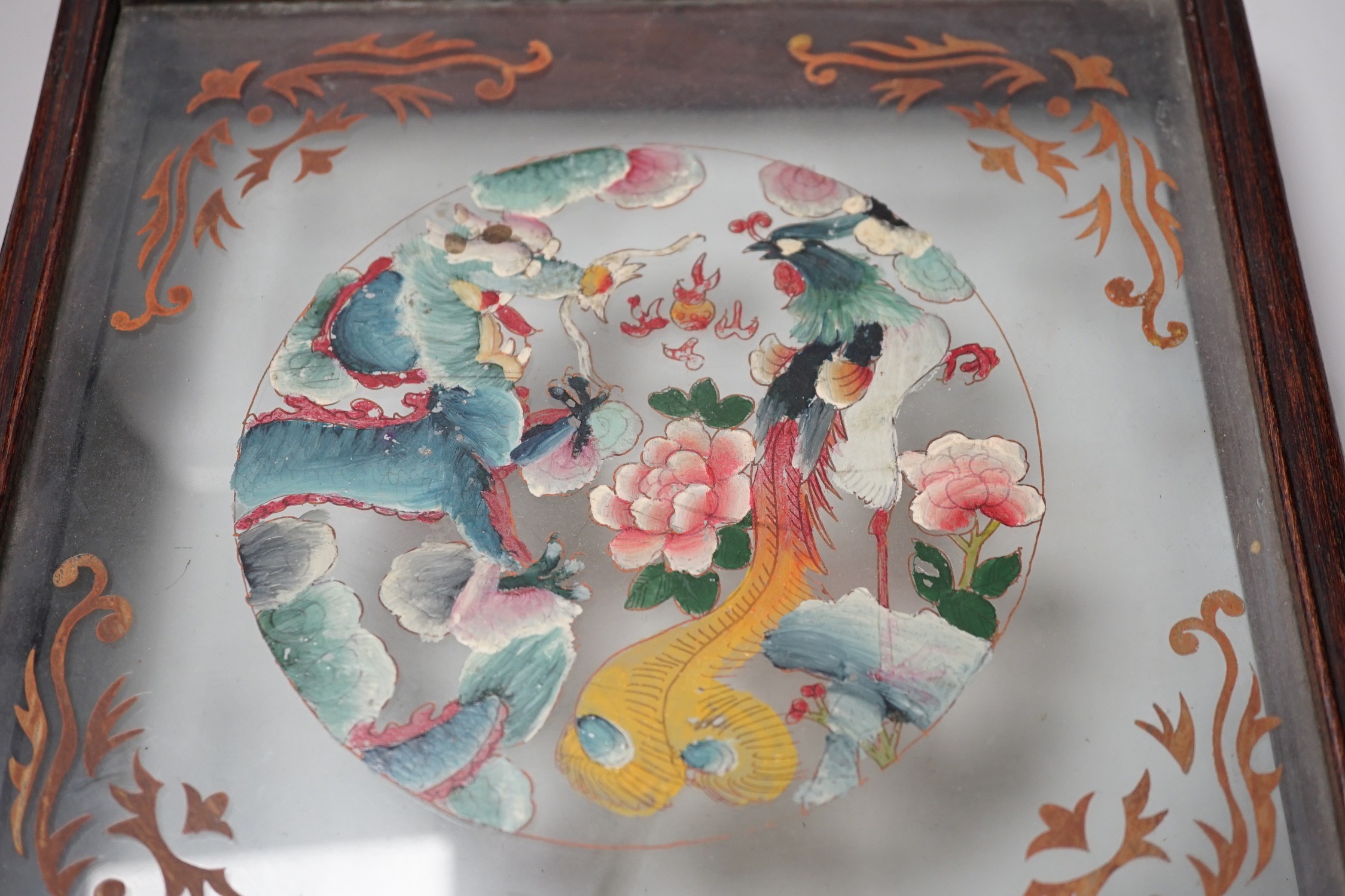 A Chinese reverse glass painting and a box cover with reverse painted glass panel